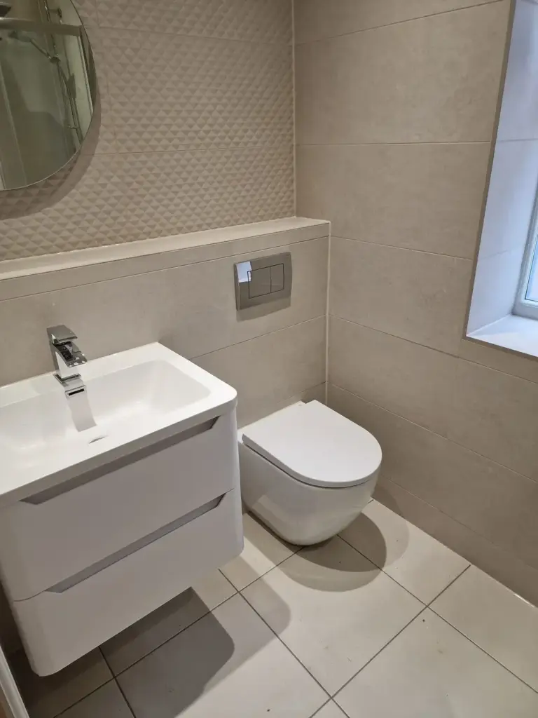 bathroom renovation with fitted basin and tiled wall finish