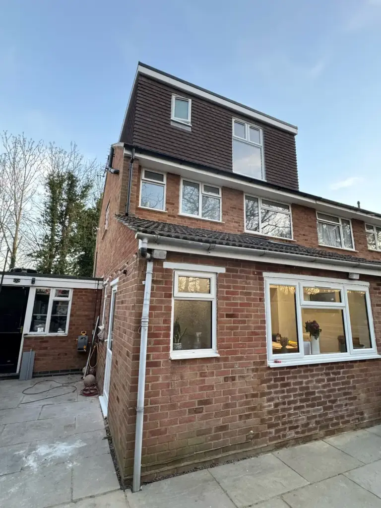 builders in surrey loft conversion on brick residential property