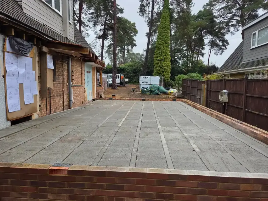 groundworks contractors surrey completing concrete base outside garage