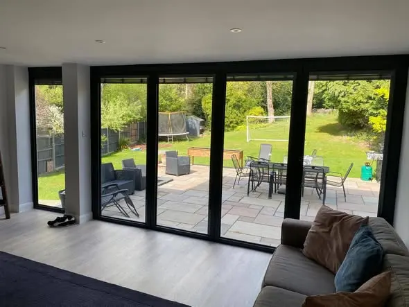 Harpers Home Developments 11 house renovation woking with large glass doors and garden view