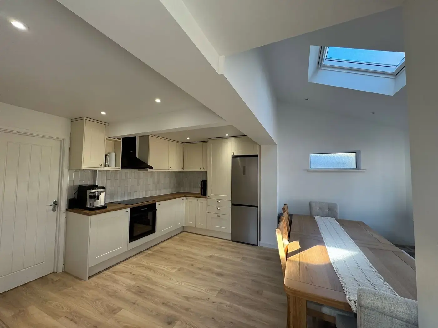 loft conversion specialists surrey with modern kitchen and skylight