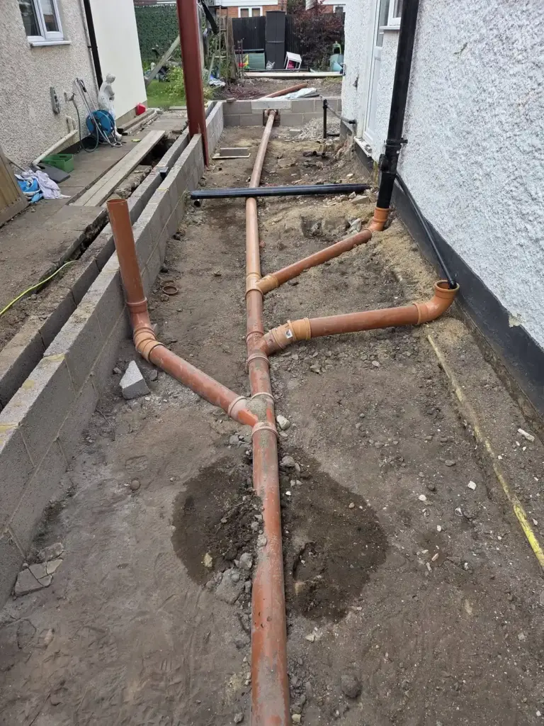 Modern Rear Extension In New Haw Creating More Space At Home 5 groundworks underground drainage pipework