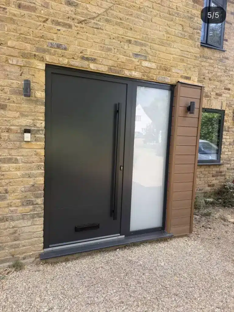 Projects 9 house extension and renovation with a modern entrance door on a stone property.