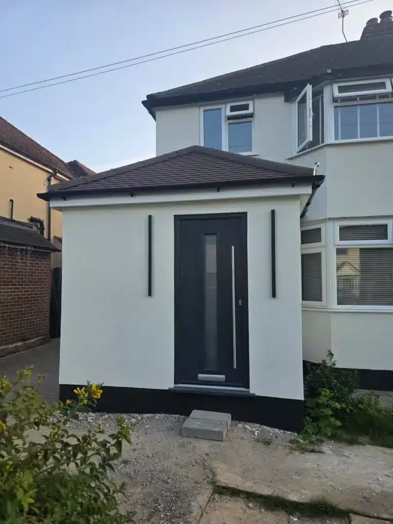 Extension And Structural Alteration In New Haw For More Open-Plan Living 6 house extension rendered entrance porch