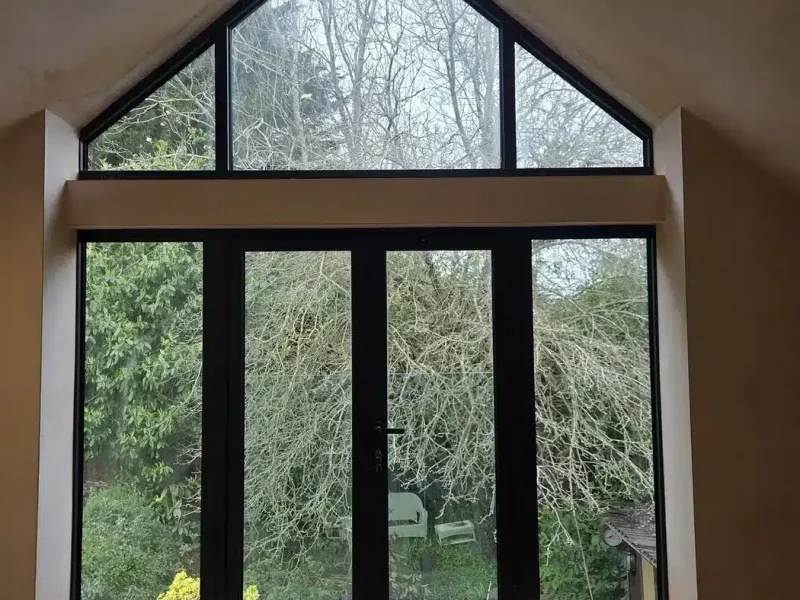 Garage Conversions 7 garage conversion specialists surrey with bright gable window and garden doors