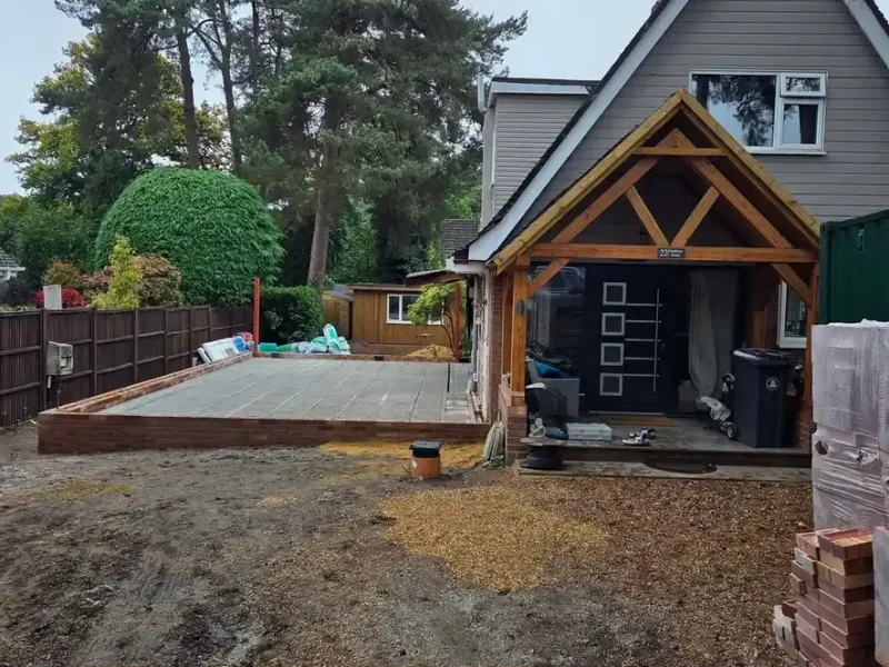groundworks contractors surrey preparing new base outside residential property