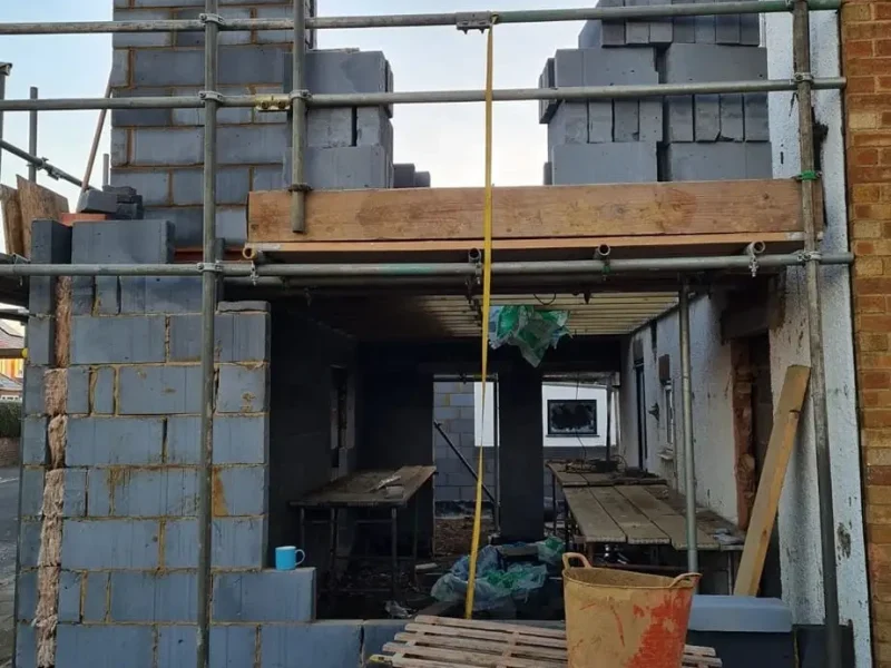 New Roofs 6 new roof installers in surrey working on residential roof structure with scaffolding